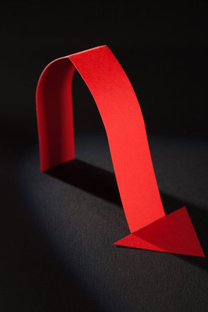 Red arrow showing down, black background