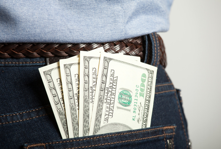 Dollar banknotes in man's back pocket - closeup shotの写真素材