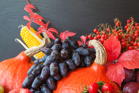 Composition of fresh raw fruits and vegetables on slate board backgroundの写真素材
