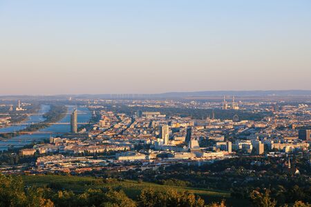 Beautiful view of the evening skyline of Vienna and Danube River with green trees of Doebling district, Austria. Travel photo of the landmarkのeditorial素材