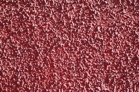 Abstract texture of the red coating of the wall, closeup viewの写真素材