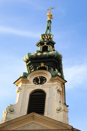 Autumn view of the Stiftskirsche tower: Vienna, Mariahilferstrasseの写真素材