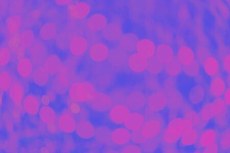 Fantasy blue and lilac background with blurred bokeh lightsの写真素材