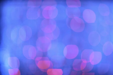Bright and vivid bokeh blue and purple defocused lightsの写真素材