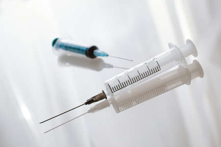 Medical syringe on the white backgroundの写真素材