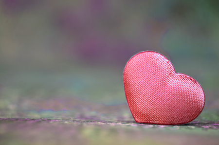 Valentine's Day heart fabric color over light backgroundの写真素材