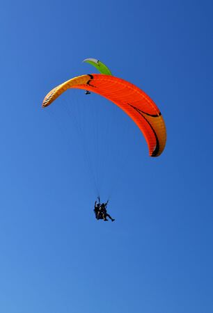 paraglider fly blue sky sunny dayの写真素材
