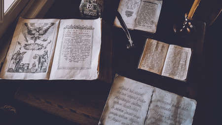 Old shabby books on the tableの写真素材