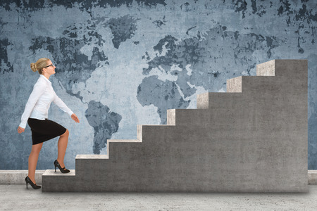 Business person stepping up a staircase. business conceptの写真素材