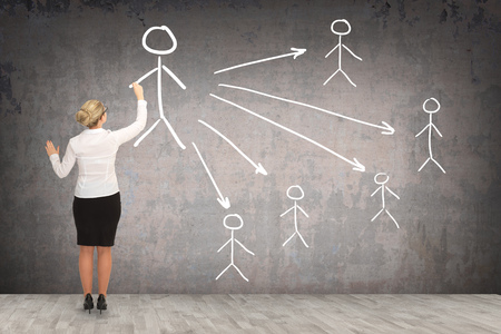 Business woman drawing on the wall. business conceptの写真素材