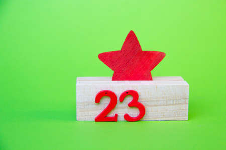 Background of Defender of the Fatherland Day. February 23. A clean notebook, a military cap, a St. George ribbon. Space for text. A red star on a green background. February 23の写真素材