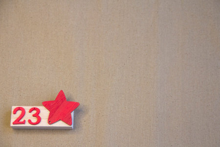 Background of Defender of the Fatherland Day. February 23. A clean notebook, a military cap, a St. George ribbon. Space for text. A red star on a green background. February 23の写真素材