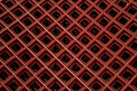 Red reticulated surface of back of chairの写真素材