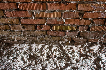 Brick corner of an old abandoned unfinished buildingの写真素材