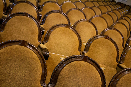 brown rows of arm-chairs of visual hall of theatreの写真素材