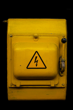 Old electric Knife-switch of yellowの写真素材