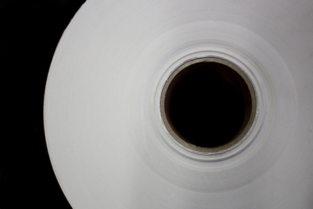 Roll of white paper on a cardboard shellの写真素材