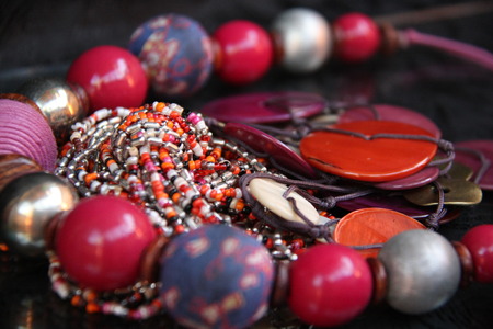 closeup of a woman's glass bead necklaceの写真素材