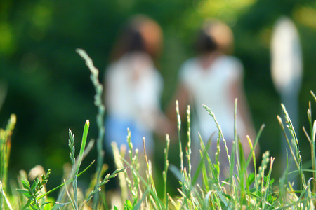 Beautiful Girls Having Fun Outdoor. Freedom Concept. Nature. Green Fieldの写真素材