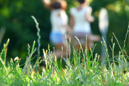 Beautiful Girls Having Fun Outdoor. Freedom Concept. Nature. Green Fieldの写真素材