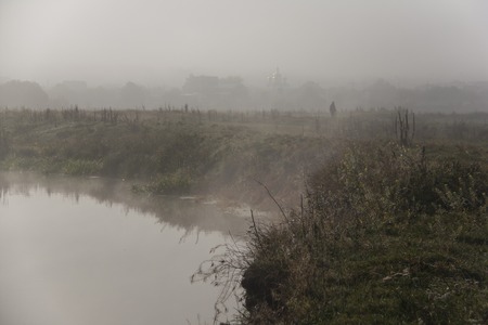 The river covered with fog in the morningの写真素材