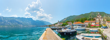 Boats near pier in Prcanj, small town in Montenegro. Panoramic view