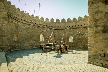 Very old gun for throwing stones to be protected. Old castle wallsの写真素材