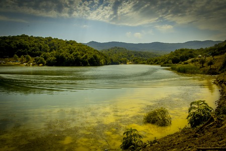 Mountain landscape, beautiful view of the picturesque lake in the mountain gorgeous, cloudy weatherの写真素材