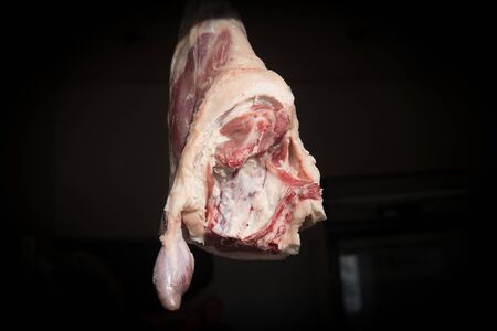 Goat hip meat hanging at an asian market or bazaar for sale.の写真素材