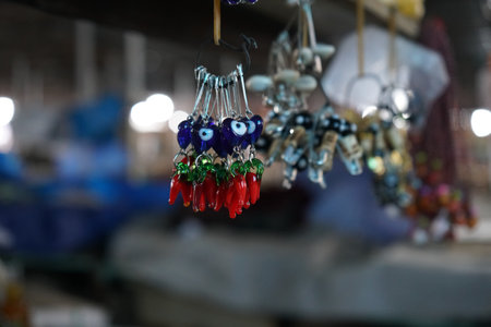 Evil eye beads and red chill pepper amulet. Close up shot.の写真素材