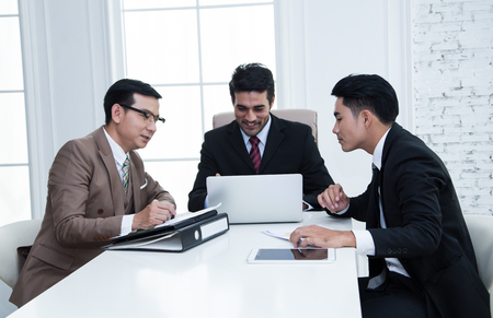 Business partners discussing documents and ideas at meeting.Teamwork Conceptの写真素材