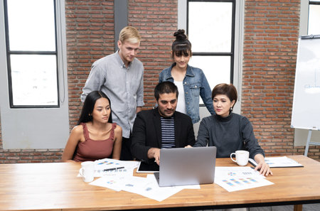 Group of caucasian coworkers working new startup project at modern office.Business meeting concept.