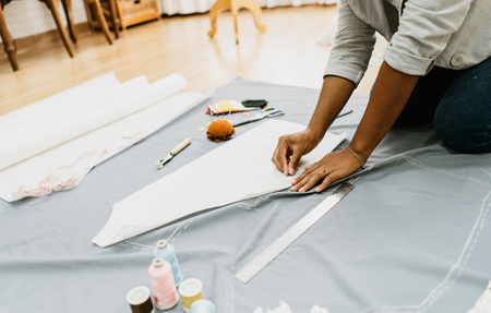 Fashion Designer woman working in her tailor shop, Tailoring, close up. Tailor Made and Small Business owner Conceptの写真素材