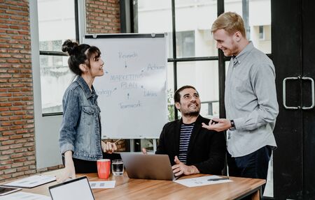 Group of Multi ethnic young business people or designers work and communicating while sitting at the office in Modern Boardroom. Business,Teamwork and Technology conceptの写真素材