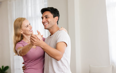 Romantic middle age couple at home. Happy loving husband and wife are enjoying spending time...
