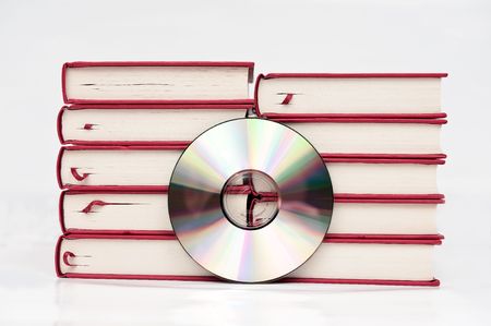 Replacing data from stack of books with data on one CDの写真素材