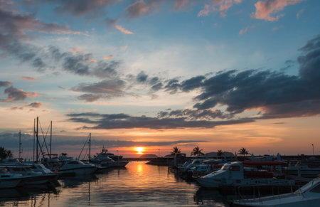 sunset with cloud sky on the pier with yachts in malaysiaのeditorial素材