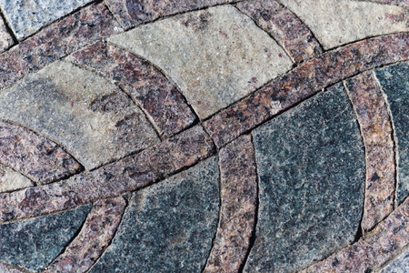 granite  mosaic maroon-black element in the parkの写真素材