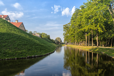 Ancient restored castle with a moat in the Nesvizh  city. Belarus.の写真素材