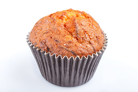 One carrot muffin isolated on whiteの写真素材