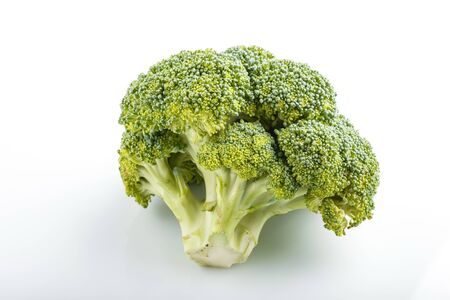 Fresh green broccoli isolated on white background, side view, close up.の写真素材