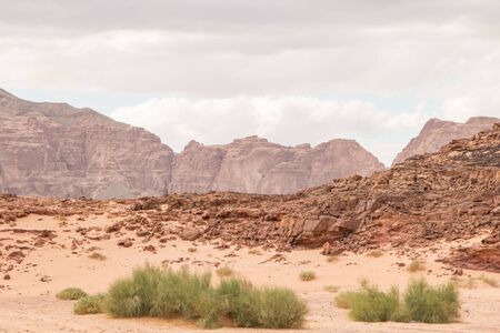 Desert, red mountains, rocks and cloudy sky. Egypt, color canyon, the Sinai Peninsula, Dahab.の写真素材