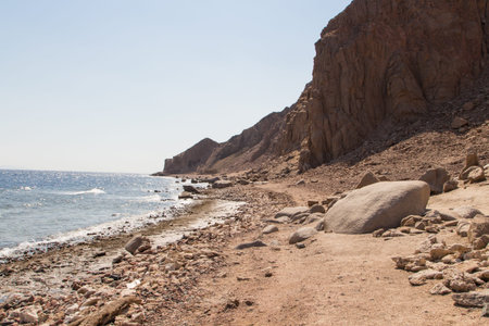 The coastline of the Red Sea and the mountains in the background. Egypt, the Sinai Peninsula, Dahab.