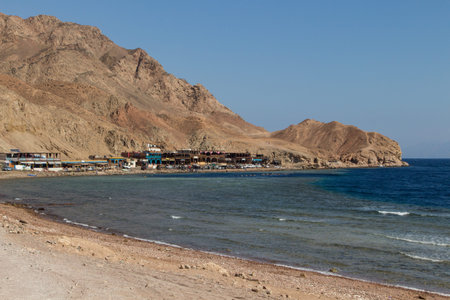 The coastline of the Red Sea with small resorts and the mountains in the background. Coral reef Blue Hole. Egypt, the Sinai Peninsula, Dahab.の写真素材