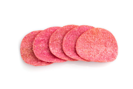Red potato chips isolated on white background. Top view, flat lay, close up.の写真素材