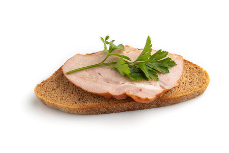 Smoked pork ham sandwich isolated on white background. Top view, flat lay, close up.の写真素材