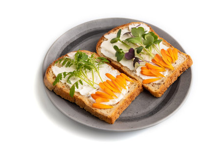 White bread sandwiches with cream cheese, calendula petals and microgreen radish and tagetes...