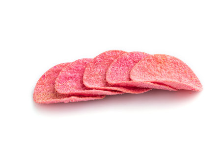 Red potato chips isolated on white background. Side view, close up.の写真素材