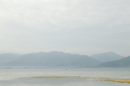 Lombok and Gili Air islands, overcast, cloudy day, sky and sea. Vacation, travel, tropics concept,...