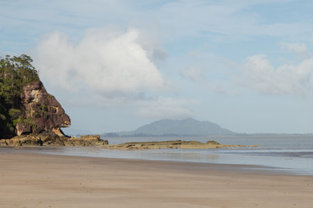 Cliff in Bako national park, sunny day, blue sky and sea. Vacation, travel, tropics concept, no...